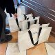 High-end clothing store woven bag women's clothing packaging packaging large capacity shopping belt portable white bag wholesale