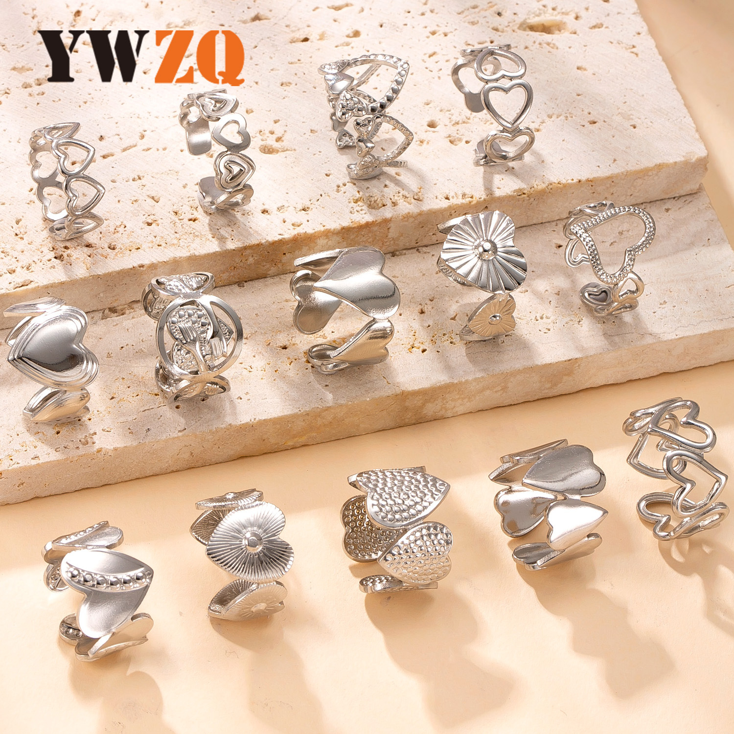 Venta caliente transfronteriza anillo abierto de acero inoxidable acero titanio no se desvanece joyería de mano simple presión de aceite hueco amor fábrica de anillos