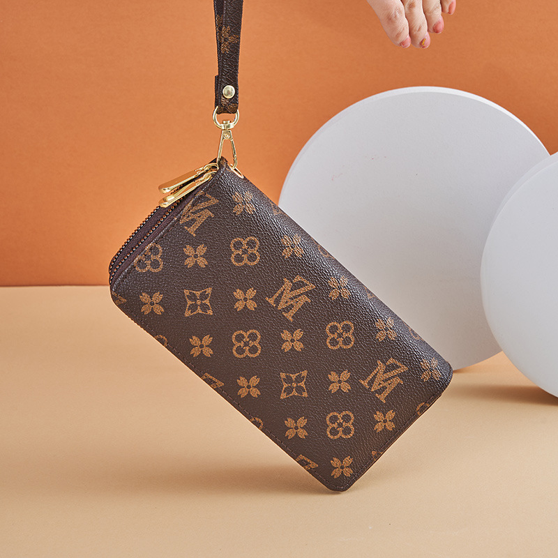 Cartera larga para mujer nueva 2025 popular europea y americana de gran capacidad con doble cremallera bolso para teléfono móvil bolso de mano con letras impresas