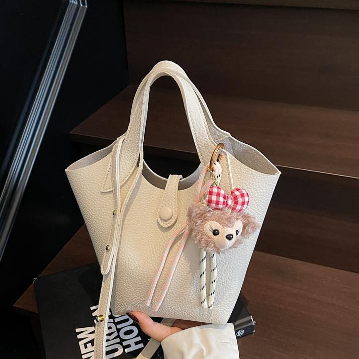 Bolso de canasta de verduras transfronterizo para mujer 2025 nuevo bolso de hombro casual simple bolso de cubo de mensajero de cuero suave de todo fósforo