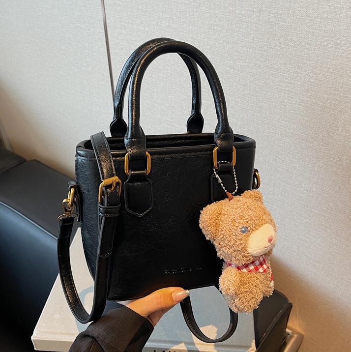 Bolsa de balde para mujeres 2024 nuevo retro versátil bolso de hombro portátil otoño-invierno súper caliente nicho de diseño de alta calidad bolso de mujer