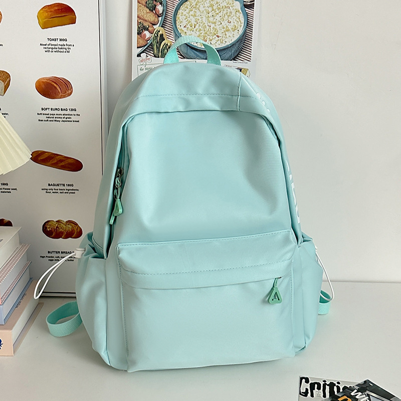 Mochila de gran capacidad para estudiantes de secundaria femenina simple y versátil para estudiantes de secundaria japonesa mochila de diseño