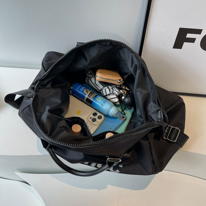 Bolso de viaje de corta distancia de gran capacidad de sensación de alta calidad Bolso de equipaje de almacenamiento portátil impreso de moda Bolso de gimnasio de mensajero de hombro para mujer