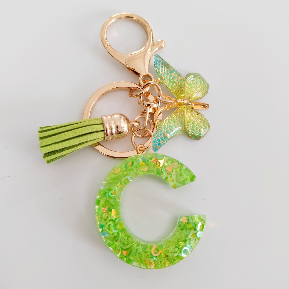 26 letras inglesas llavero colgante estrella verde brillo gota resina colgante llavero de personalidad europea y americana