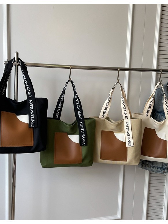 Fábrica directa tote bolsas de lona de niñas bolsas de hombro resistentes al desgaste simple letras impresión bolsas de comercio exterior transfronterizas