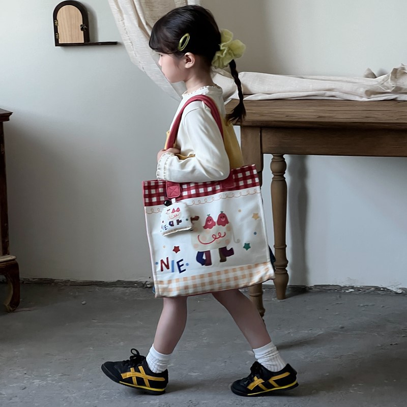Caricatura de niños y niñas, bolsos de hombro de gran capacidad, bolsos de nicho de diseño, bolsos de mano nuevos lindos para niñas