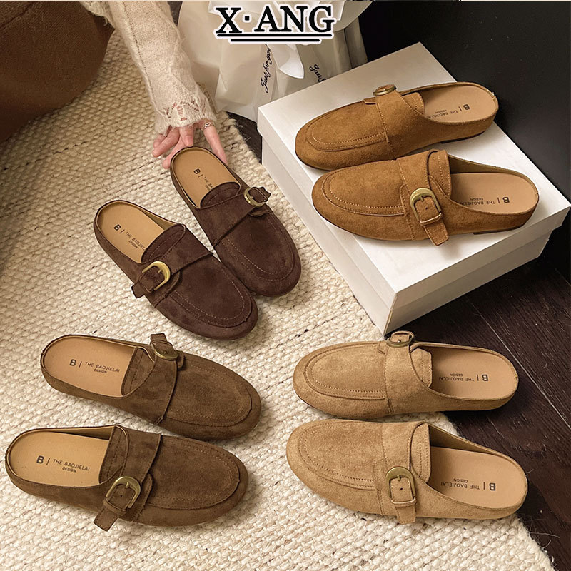 Genuine leather slip-on mules, perfect for wearing outdoors, in the style of Birkenstock or Loafers, with a retro and vintage aesthetic