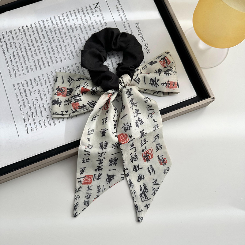 Anillo de cabello de arco femenino retro elegante correa francesa temperamento de alta sensación de impresión de anillo de intestino suave tocado versátil