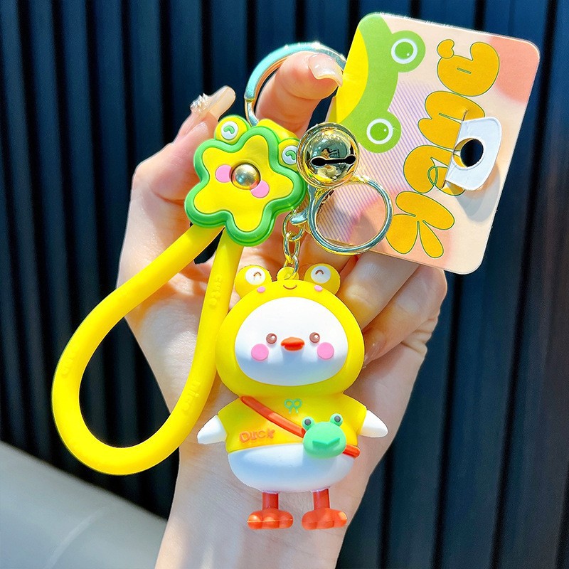 Keychain dinosaurio auténtico lindo bolso colgante de goma blanda llavero de automóvil muñeca pequeña máquina de regalos al por mayor image 19