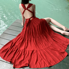 三亜の海辺で写真を撮る服の超仙の赤いストラップのビーチのロングスカートのタイは休暇のワンピースの高級感を着ます。