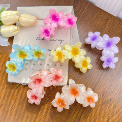 女性欧米は国境を越えて11cmの大サイズの卵の花を販売して海辺の休暇の後頭部の花のサメのクリップをつかみます。