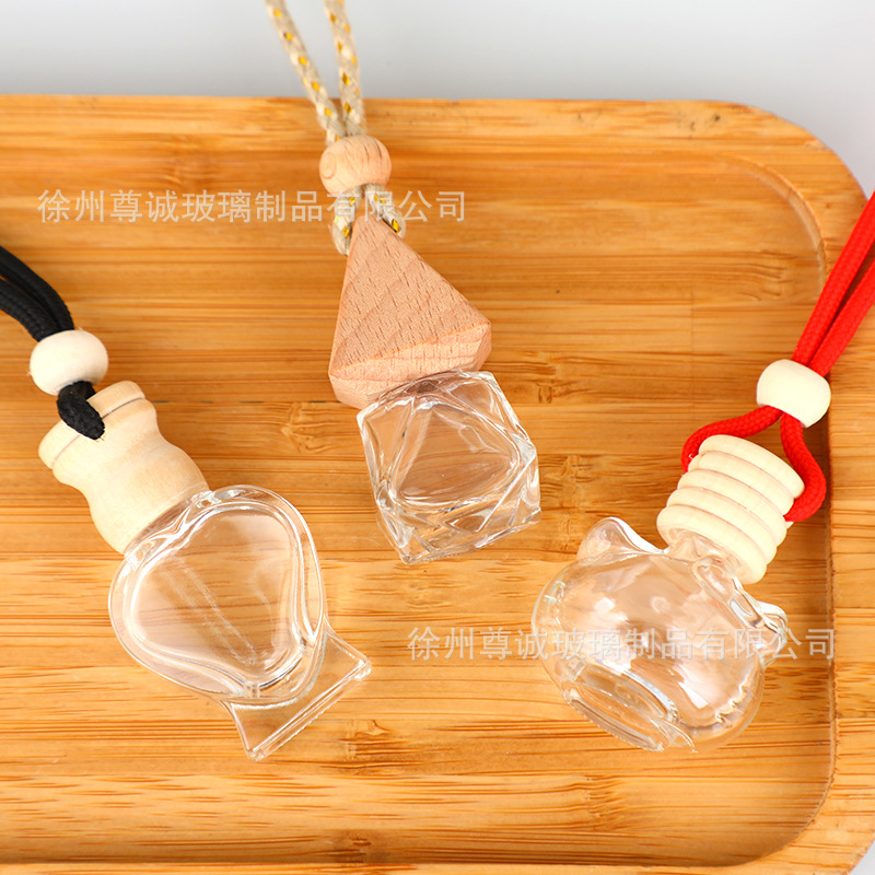 Botella de perfume de cables de automóvil botella vacía botella de perfume de automóvil colgante tapa de madera botella vacía perfumes volátiles al por mayor