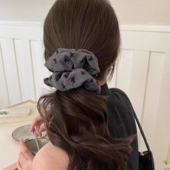 気質の蝶結びの波点の大腸の髪輪の女性は団子の髪のひもの高弾力の丈夫なゴムのひもの髪飾りを刺します。