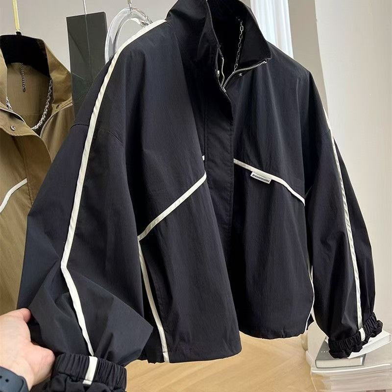 Stylish and unique loose-fitting slimming casual drawstring stand-up collar short jacket for women, spring and autumn baseball jacket