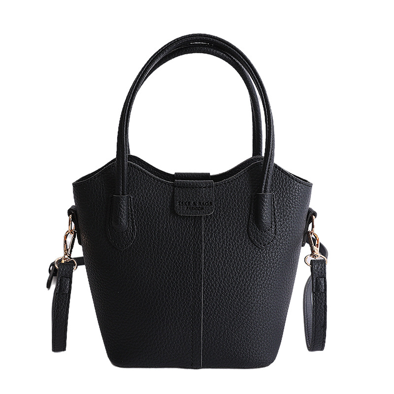 Bolso de mano de moda retro 2026 nuevo temperamento simple bolso de cubo de viaje ocio mochila de hombro