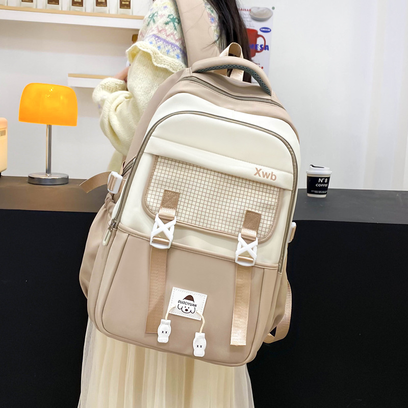 Al por mayor 2025 nuevos estudiantes de primaria de secundaria masculinos mochila de escolares de escolares de alta niñas mochila de viaje de gran capacidad