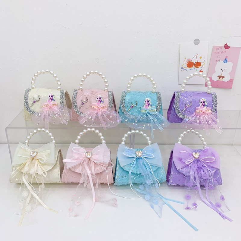 Nuevo bolso de moda para niños bolso de perla animado lindo arco de botón bolso de hombro de niñas cadena diagonal bolso pequeño