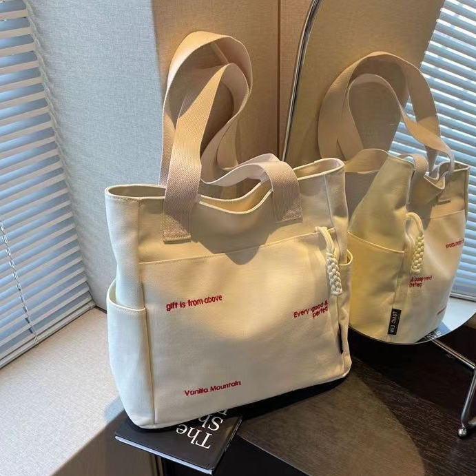 Bolsa de mano ligera para mujeres en clase de hombro único bolso de lienzo con cremallera de estilo coreano