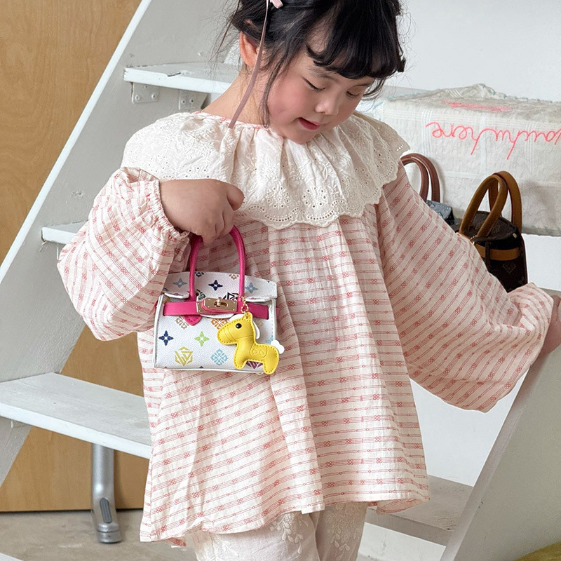 Impresión de moda coreana bolsos de chicas lindos colgantes de pony bolsos de hombro de aire extranjero mini bolsos de niños