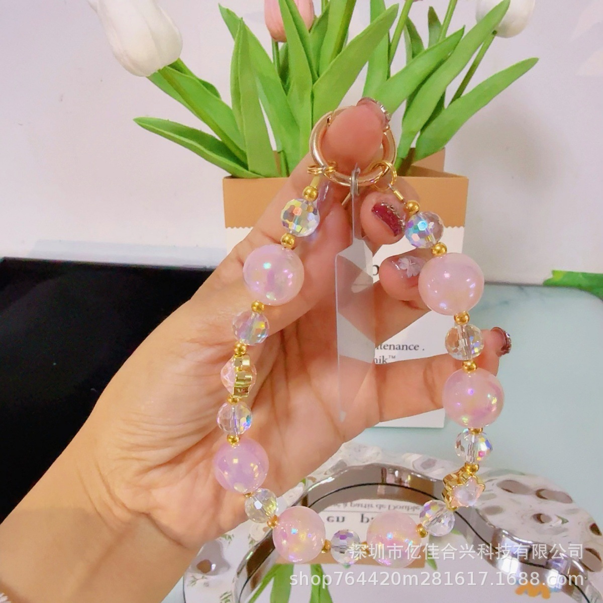 Mayorista cadena de teléfonos móviles sensación de alta calidad estereoscópica bola pentagonal llave colgante perla de teléfono móvil colgante pulsera nuevo