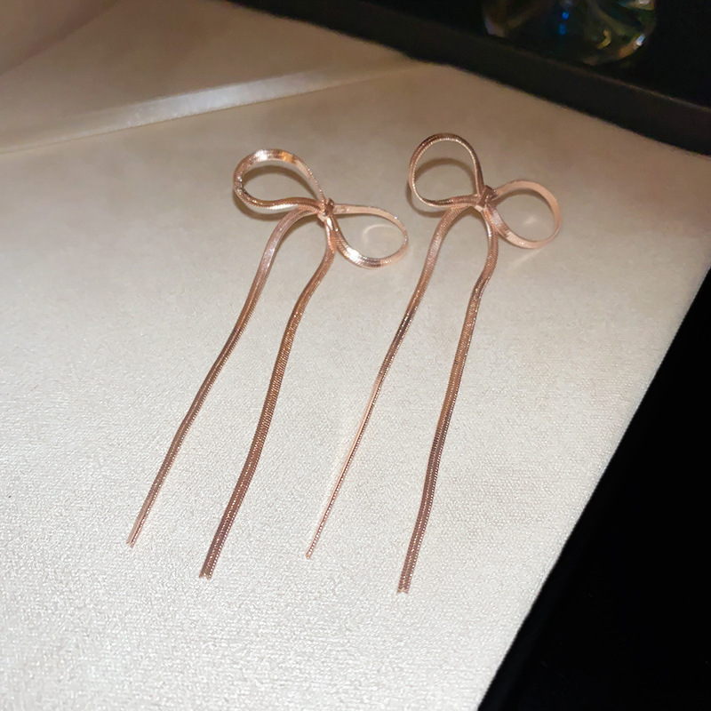 Aguja de plata Pendientes de lazo de diamantes coreanos Pendientes de temperamento de moda de todo fósforo Pendientes de diseño de nicho Sentido de lujo ligero