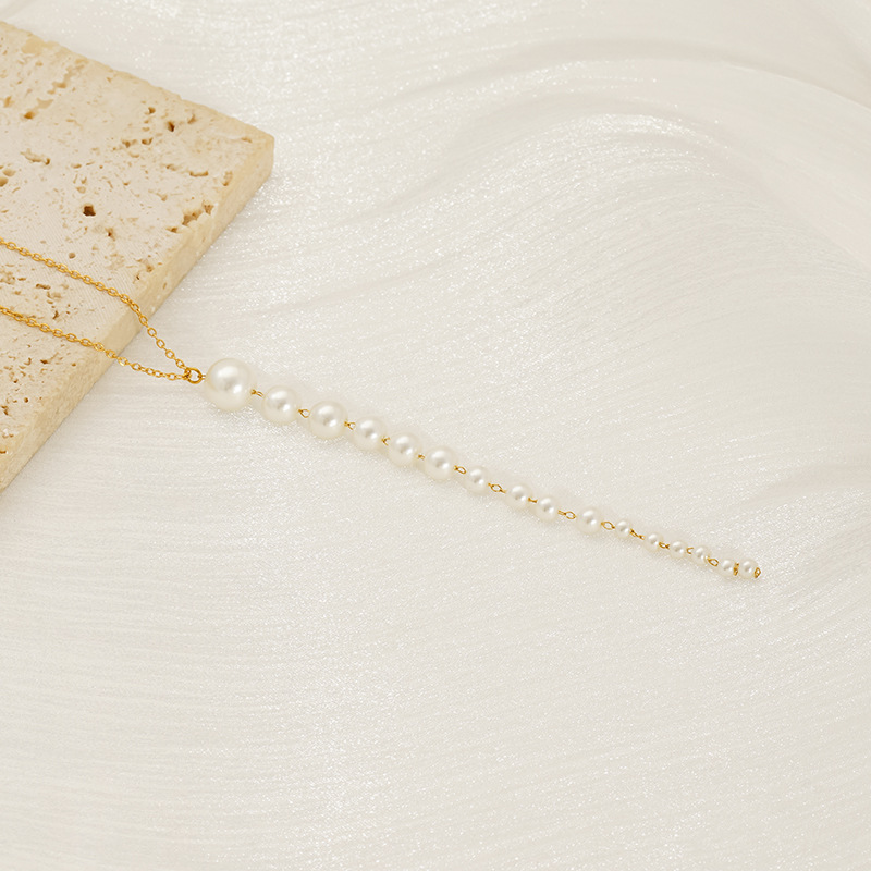 Nuevo estilo de acero inoxidable francés simple una palabra colgante de perlas personalidad femenina creativa collar de tamaño de perla larga mujer