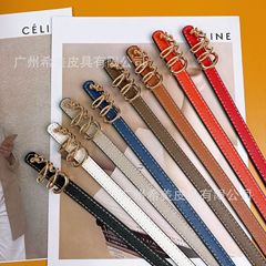 カジュアルでシンプルなアルファベットのボタンの多色の女性の細いベルトとジーンズのスカートのファッションの女性の装飾ベルト