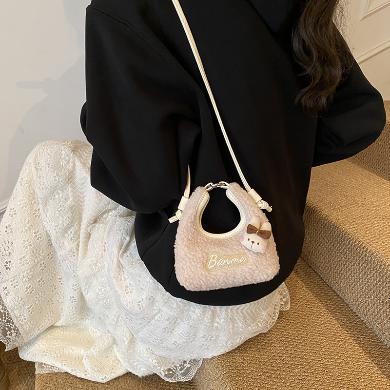 2025 otoño y invierno nuevo bolso infantil lindo peluche conejo pequeño bolso de cambio bebé mini bolso de hombro para hombres y mujeres