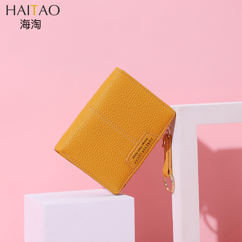 Cartera corta de mujer de color sólido de lujo ligero nicho Volkswagen gran capacidad dos carteras plegables cremallera mini bolso de cambio de mujer