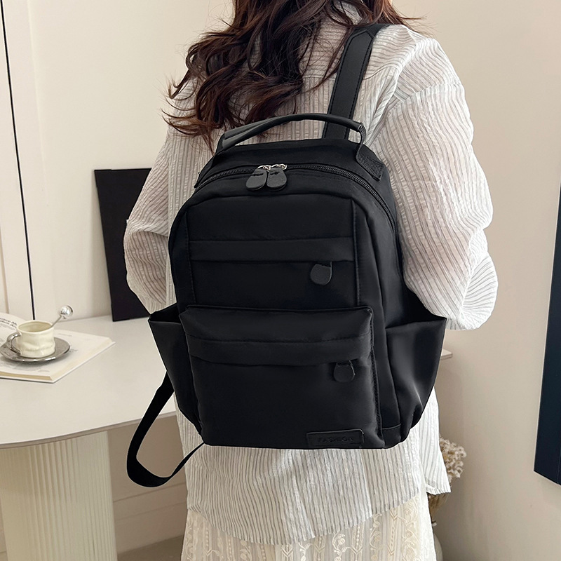 2025 primavera nueva mochila simple de color sólido mochila de estudiantes de escuela primaria mochila de viaje al aire libre
