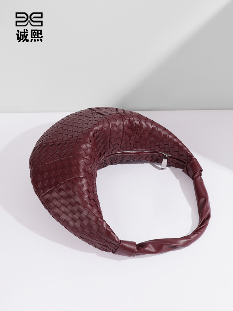 アマゾンの人気牛の角編みの三日月の包みのファッション的な手は復古のギョーザの包みを持ちます。