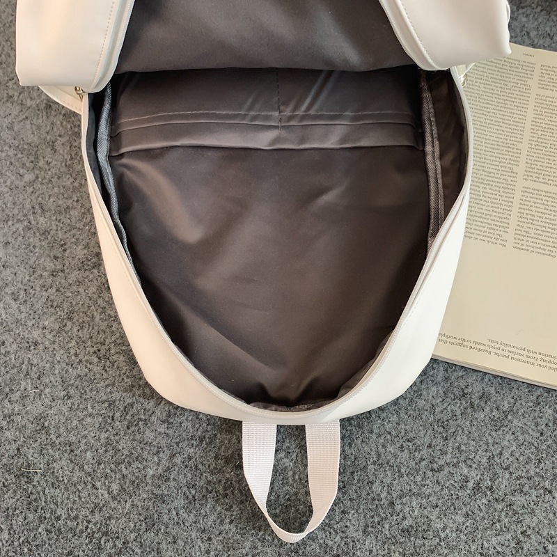 2023 nueva mochila de cuero suave de pareja de gran capacidad casual simple y versátil mochila escolar de computadora de viaje al aire libre al por mayor