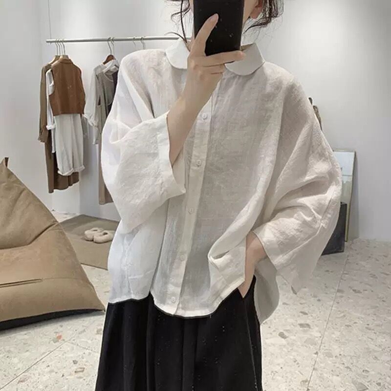 綿麻のシャツの女性の夏の新型のレトロなデザイン感がゆったりしています。