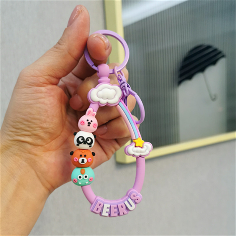 Colorido Berus dibujos animados cuerda Rana conejo llavero colgante Cadena de teléfono móvil fresco color sólido conjunto auriculares