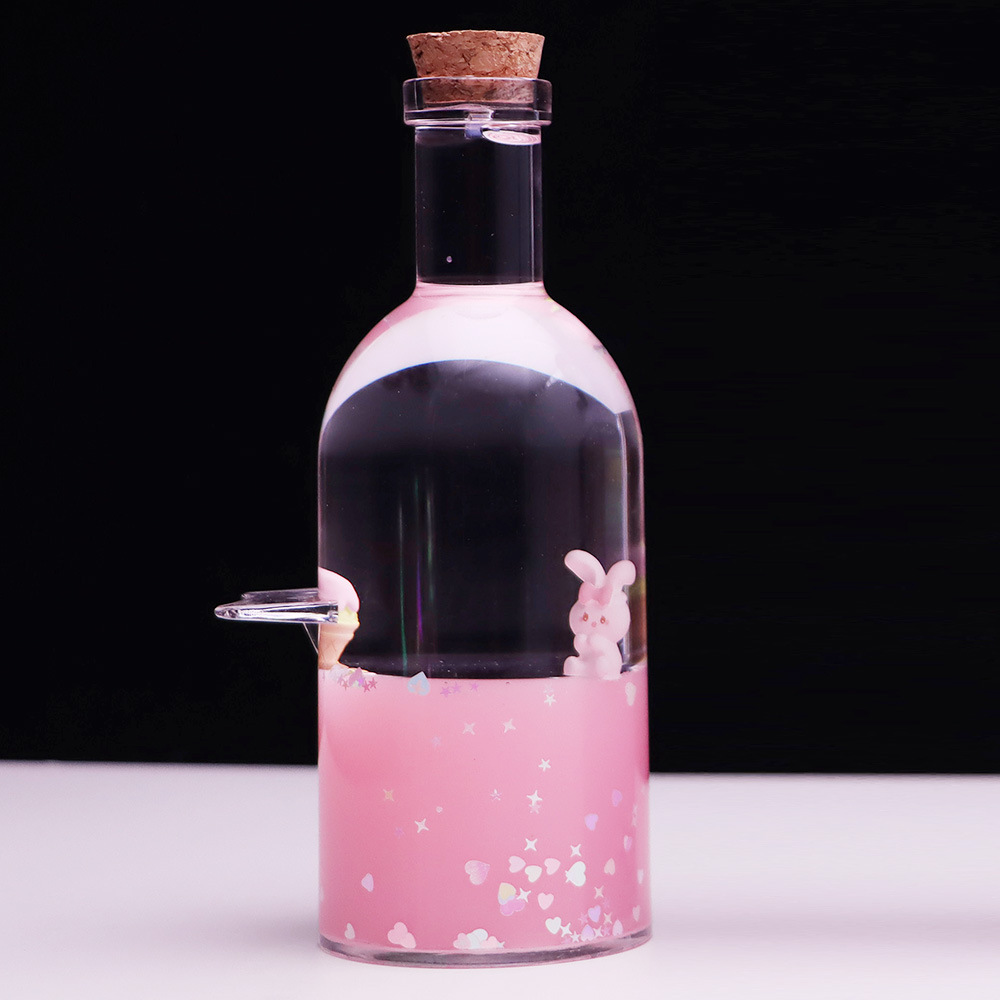 Botella a la deriva montando el viento y rompiendo las olas Botella de vela Perla Negra reloj de arena gotas de aceite Regalo de Cumpleaños descompresión decoración de escritorio al por mayor