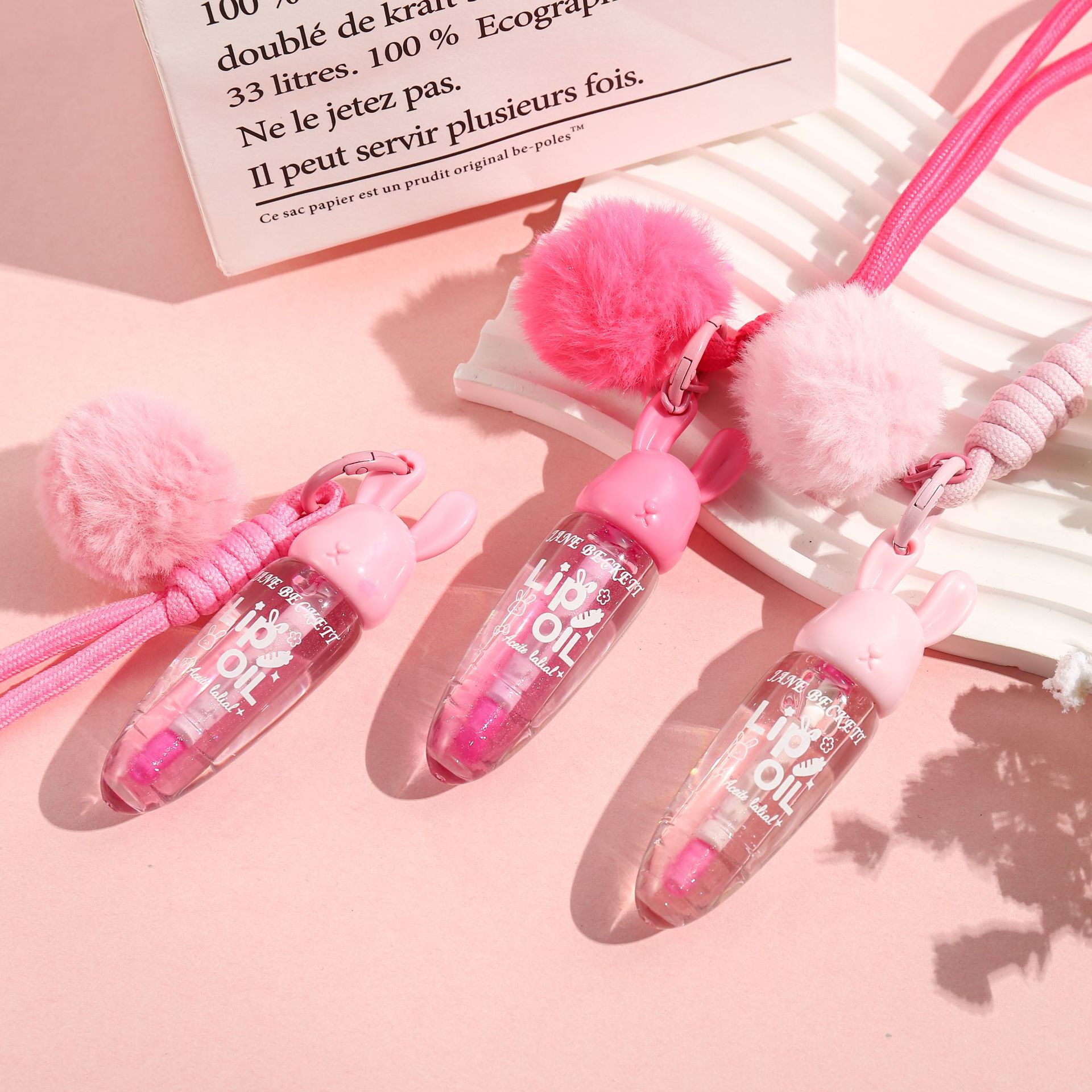 Gloss labial transparente de cristal de agua gelatina de labios humectante estudiantes baratos brillo pequeño conejo colgante esmalte labial