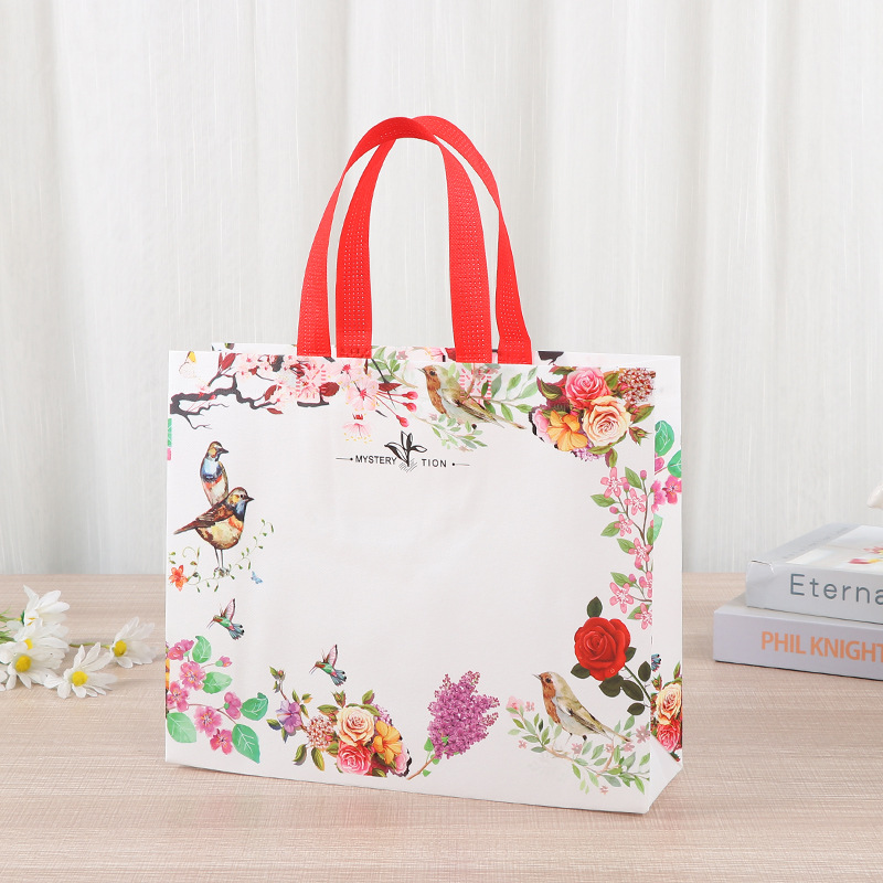 Bolsa de mano no tejida multi-especificación plegable con regalo de mano bolsas de compras de mano logotipo impresa en color bolsas de tela no tejida