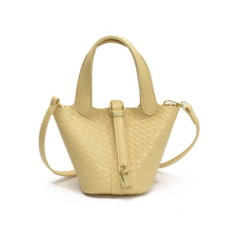 Bolso de cubo portátil con patrón tejido para mujer 2025 nuevo estilo coreano de lujo ligero de alta gama bolso de mensajero para niños de nicho