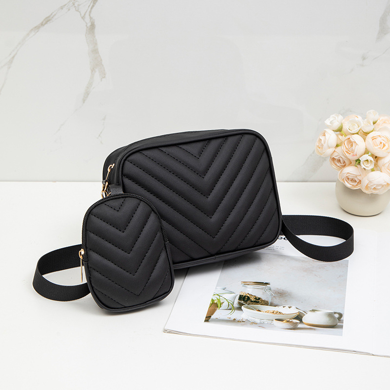 Bolsas de mujer al por mayor transfronterizas 2025 primavera y verano nueva bolsa de moda versátil bolsas de cámara de patrón en V cadena bordada bolsas de mochila