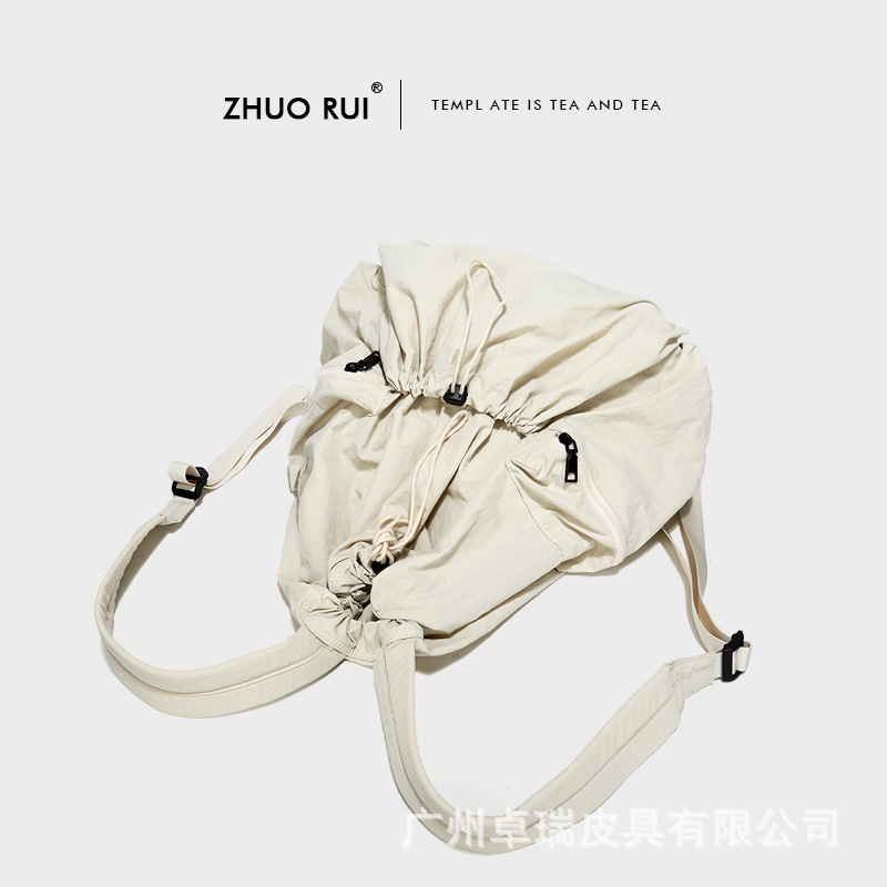 Corea del Sur Dongdaemun nuevo cordón mochila mujer casual gran capacidad estudiante mochila versátil mochila de nylon ligero