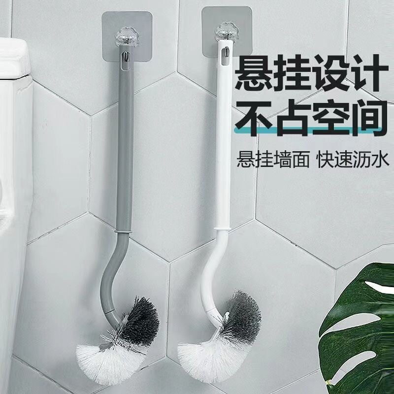 Japanese-style toilet brush with a long handle, designed for cleaning toilets and squat toilets, featuring soft bristles and a wall-mounted, angled head Japanese-style toilet brush with a long handle, designed for cleaning toilets and squat toilets, featuring soft bristles and a wall-mounted, angled head