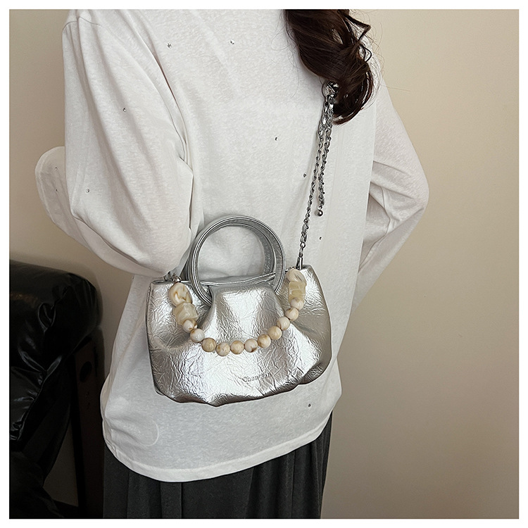 A stylish and trendy beaded bag for women, a new summer chain crossbody cloud bag for women in 2025 undefined