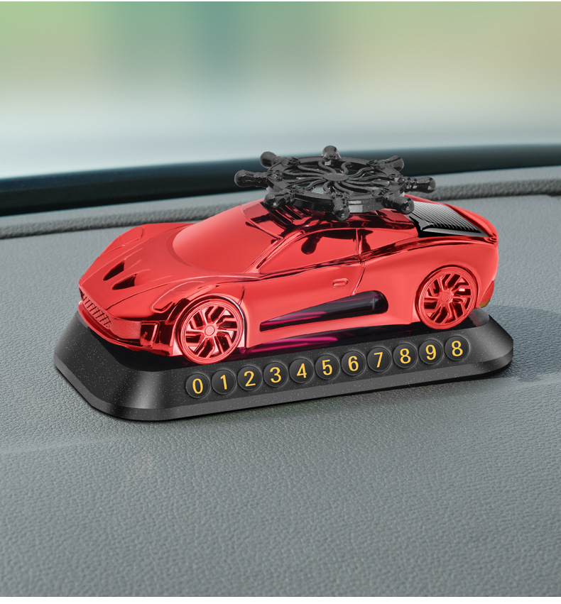 New solar helmsman car model aromatherapy ornaments car perfume three-in-one multifunctional car parking card car