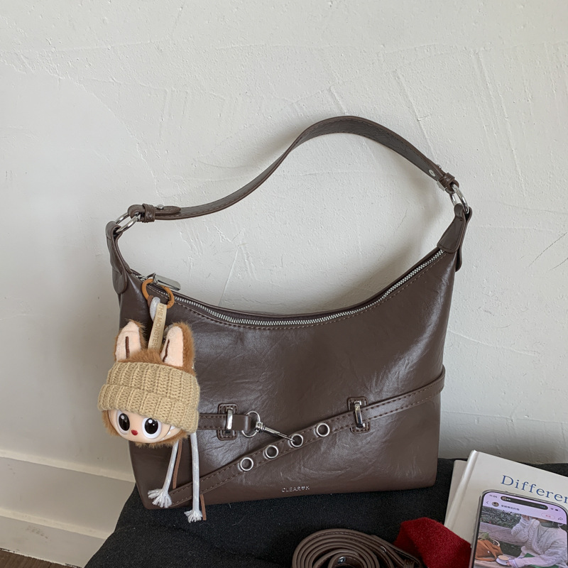 Bolsa de bolsillo de nicho francés de estilo extranjero para mujeres 2025 nueva moda versátil bolso de hombro de brazo de viaje bolso de hombro de hombro
