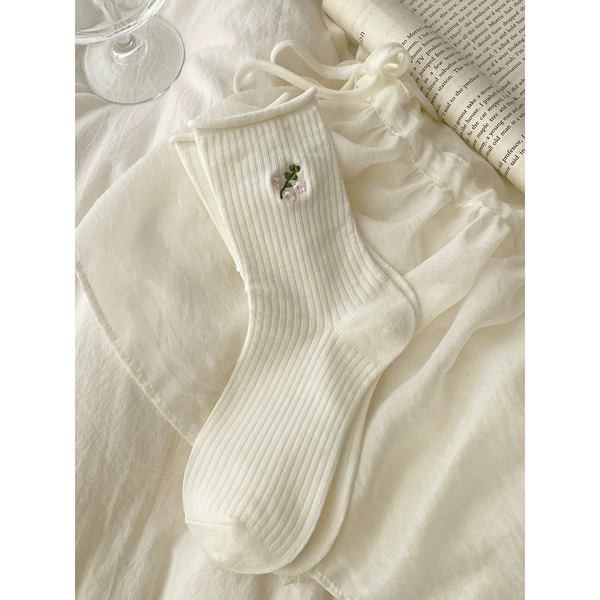 Flower-shaped, white, with embroidery