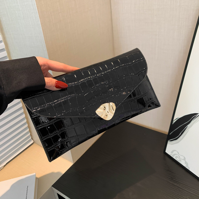 Diseño de nicho bolso de alta calidad para mujeres 2024 bolso de mano con patrón de cocodrilo de moda bolso de sobres de mujer bungee