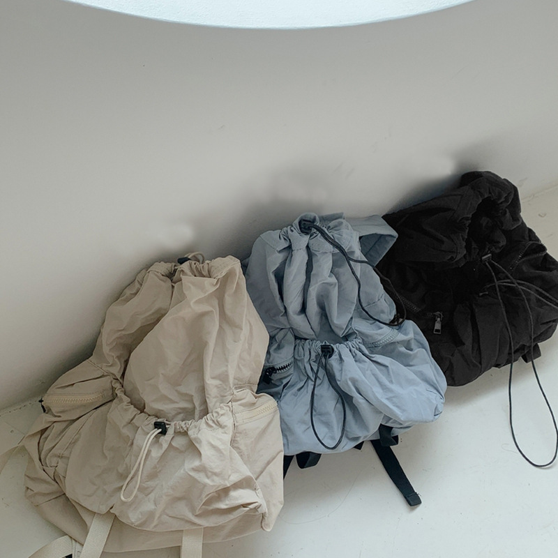 Corea del Sur Dongdaemun nuevo cordón mochila mujer casual gran capacidad estudiante mochila versátil mochila de nylon ligero