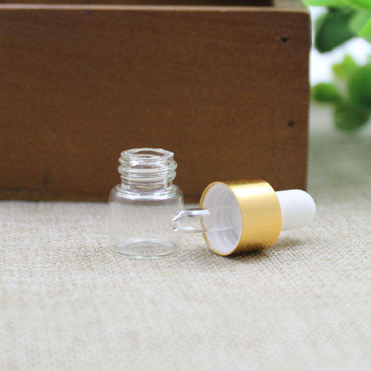 1ml de fábrica al por mayor botella de aceite esencial transparente tangente oro blanco pegamento cabeza cuentagotas botella de vidrio botella pequeña muestra botella sub-botella