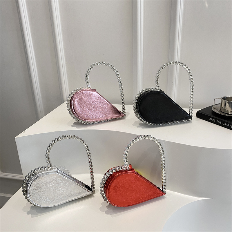 Diseño de nicho, personalidad, forma de amor, moda, estilo occidental 2025, nuevo estilo, estilo occidental, sentido avanzado, bolso de mano, mujer