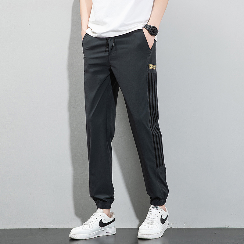 Pantalones de seda de hielo, pantalones deportivos de secado rápido de verano para hombres, pantalones casuales de nueve puntos sueltos y delgados de la marca de moda, pantalones casuales de nueve puntos al por mayor